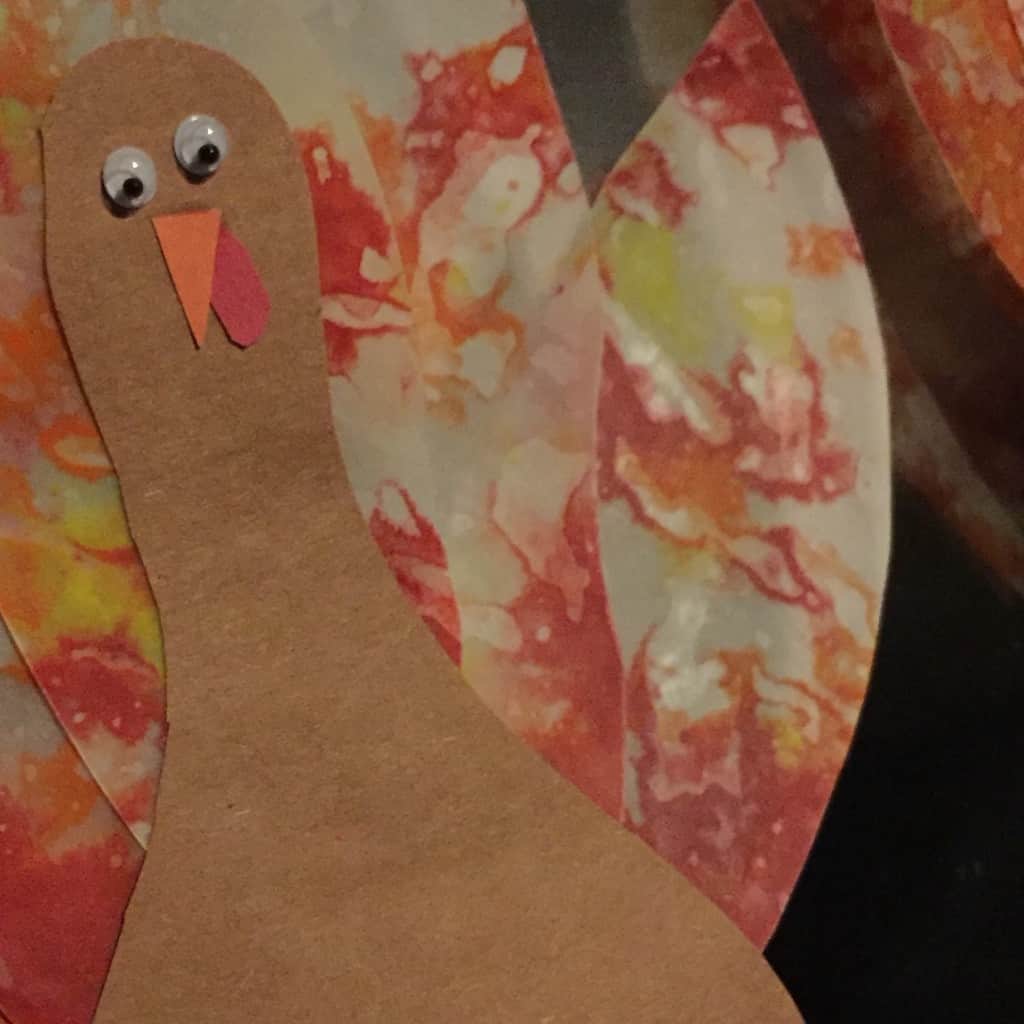 Make this colorful melted crayon turkey with your kids for Thanksgiving. Using supplies from around the house it's the perfect kids craft for the holiday!