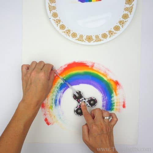 Fun fidget spinner rainbows are an amazing process art. Painting with a fidget spinner is a fun and creative way to use your hand spinner for art.