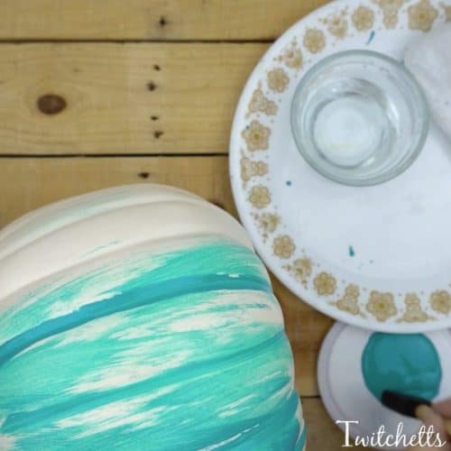 Fun teal painted plastic pumpkin to place on your porch this Halloween season. The first of this year's teal pumpkin ideas!