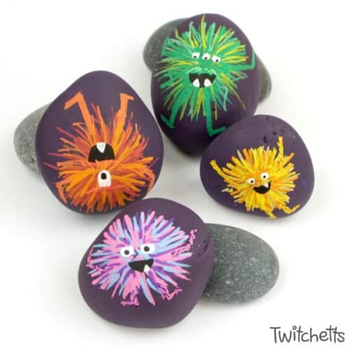 Make these adorable monster rocks with your kids and some simple rock painting supplies! They are perfect for an afternoon of crafting or a fun Halloween craft. #monsterrocks #rockpaintingideasforkids #halloween #monsters #rocks #stones #poscapaintpens #twitchetts