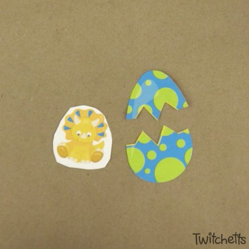 This hatching dinosaur egg craft  is lots of fun and a great craft for preschoolers. Grab our template and a couple of simple craft supplies and you have a fun craft that your child will want to play with! #hatchingdinosaureggcraft #dinosaur #egg #hatching #craftforkids #clothespin #template #twitchetts