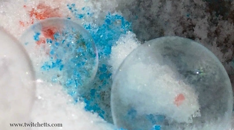Create a colored frozen bubble! This snow day activity is a great way to mix it up and sneak in a little play-based learning!