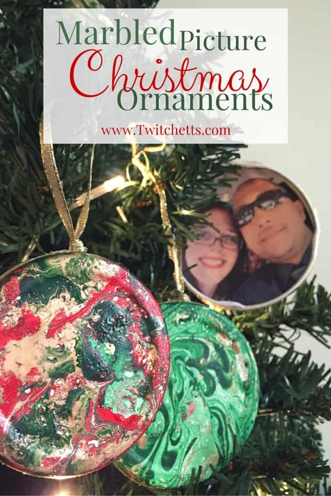 Create these DIY Marbled Picture Christmas Ornaments using upcycled jar lids. This craft is fun and easy to create for beautiful photo holding decoration.
