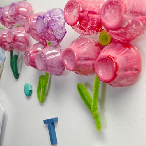 These Toddler Egg Carton Flower Magnets are perfect craft for little kids. This kids activity that is quick, easy, & turns out beautiful every time!
