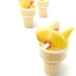 Image of peaches in an ice cream cone. Text reads "Party Foods. Olympics Watch Party"