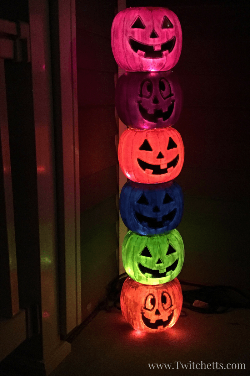 Create a fun lit pumpkin totem pole for a quick and easy Halloween decoration! DiY instructions for making your own weathered plastic pumpkins too!
