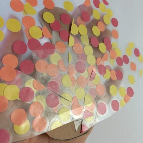 This fine motor turkey kids craft is fun for all ages! This Thanksgiving day craft is fun to create and adds a cute flare to your windows or fridge for the season.