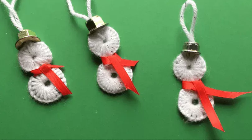 These Washer Snowmen ornaments are the perfect snowman decoration to add to your tree! These homemade ornaments make great gifts or are perfect to create for your own tree.
