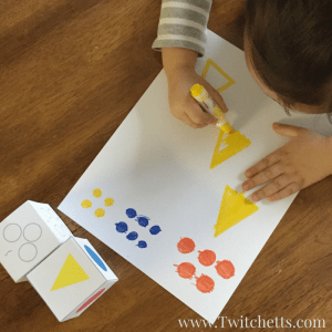 Dice games for kids are so much fun! This printable dice game is great for entertaining your preschooler at home or in the classroom. They will practice counting and drawing a couple basic shapes. All while using primary colors.