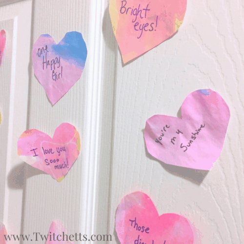This Valentine's craft is a fun preschool craft. These watercolor hearts make the perfect prop for a fun Valentine's activity for the whole family.