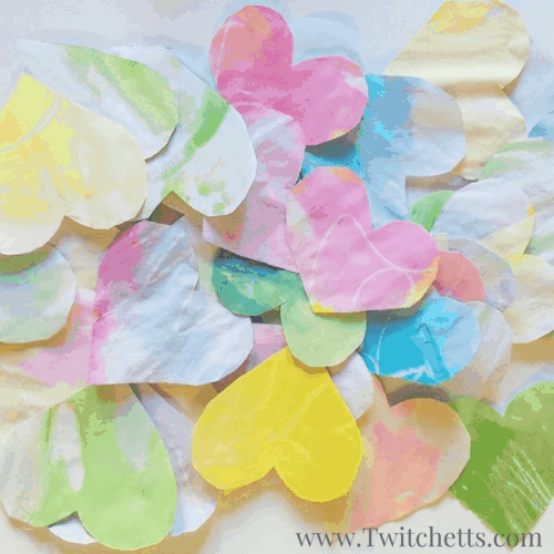 This Valentine's craft is a fun preschool craft. These watercolor hearts make the perfect prop for a fun Valentine's activity for the whole family. 