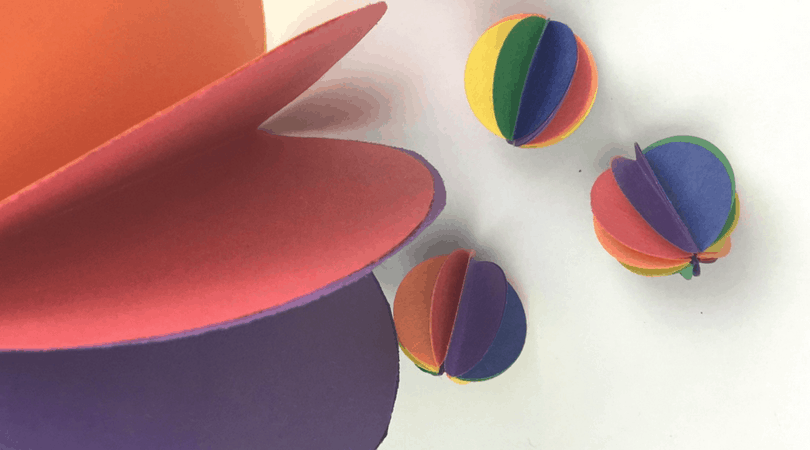 Rainbow Spheres construction paper crafts for kids. These paper spheres are fun to make and cute to have hanging around.