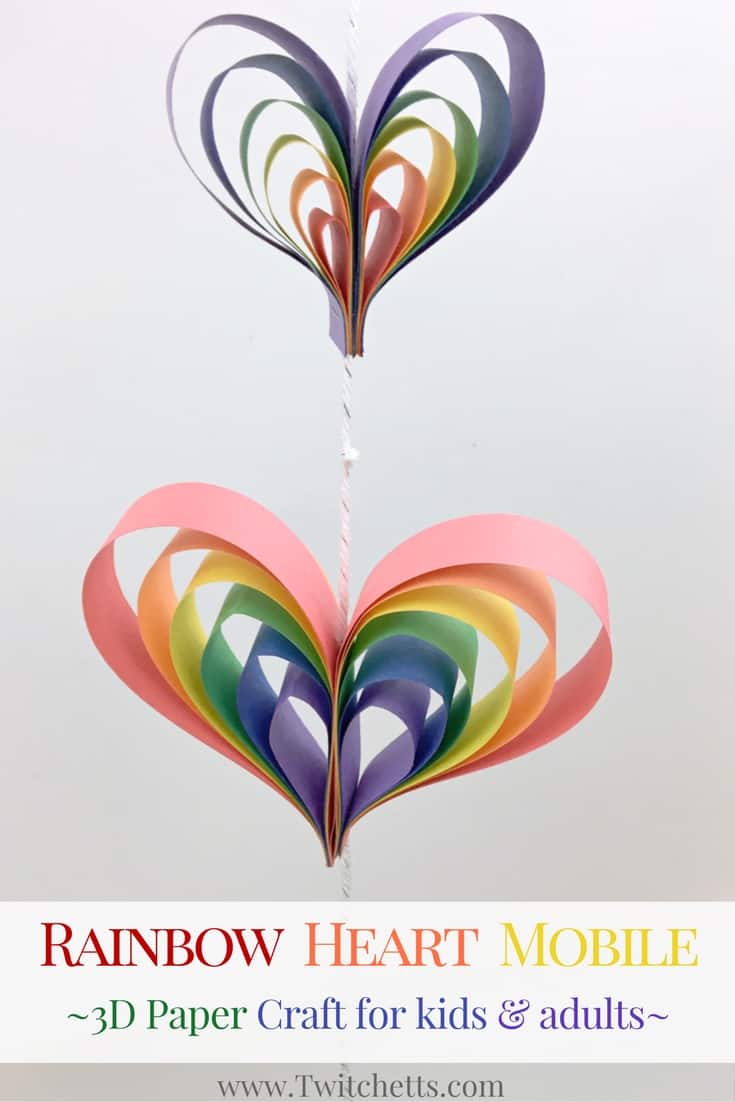 Create a spinning rainbow heart mobile using construction paper. Fun kids rainbow art project that is a perfect rainbow craft for preschoolers, kindergarteners, and kids of all ages!