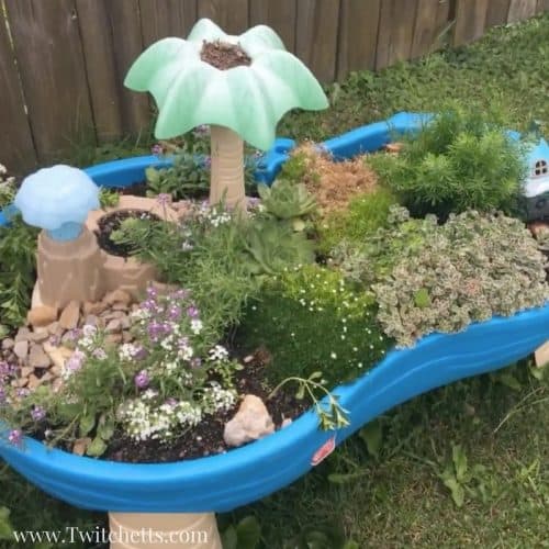 Create an epic fairy garden for kids using an old water table. Instead of trying to get it clean, let your kids experiment with growing plants and creating a mini garden.