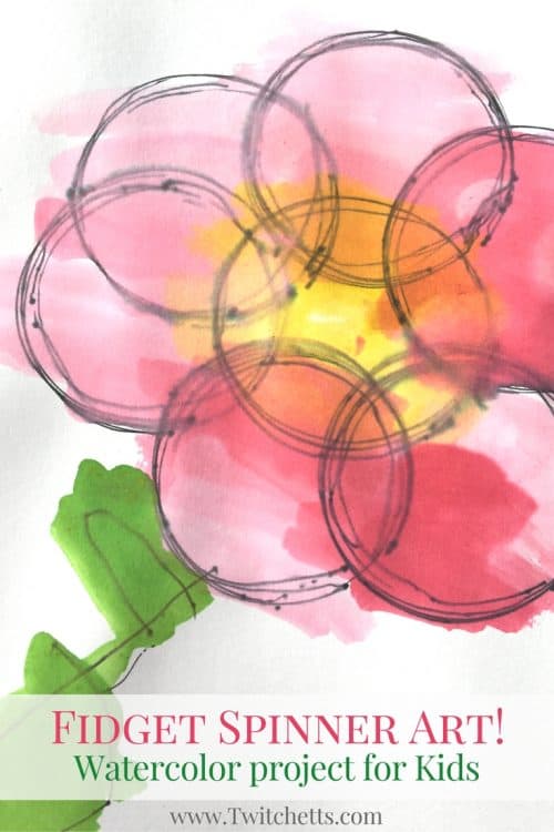 Create watercolor circles by placing a pen inside a fidget spinner hole. This fidget spinner art can be completed by kids of all ages! It's a fun process art that will be different every time.