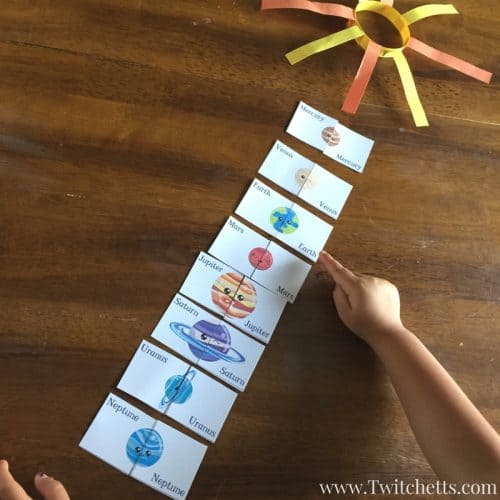 Grab this free printable and play two space themed games. This printable solar system game is perfect for preschoolers. Get them interested in outer space by playing a matching game or a fun round of memory.
