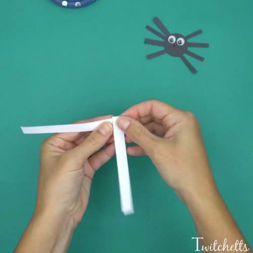 Bouncy construction paper spiders that use up some of your black construction paper. These are fun Halloween crafts for kids.