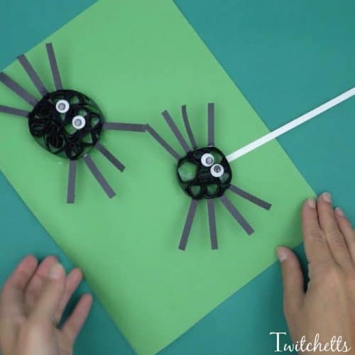 Construction Paper quilling spiders using black construction paper.