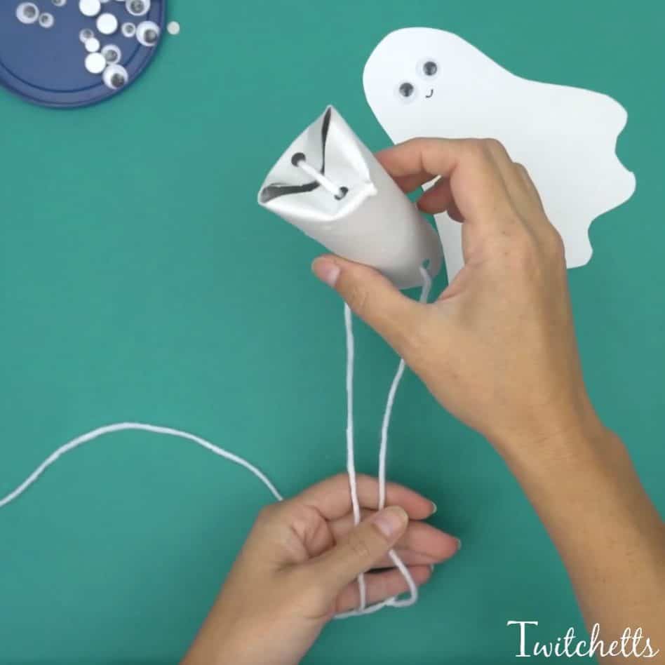 Create flying construction paper ghosts using white construction paper and toilet paper tubes. This simple craft will lead to fun kid approved Halloween ghost decorations.