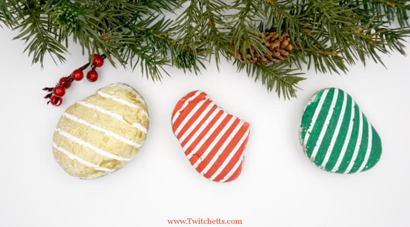 Creating these beautiful Christmas striped stones is easier than you think! This easy rock painting idea is perfect for kids or beginners.
