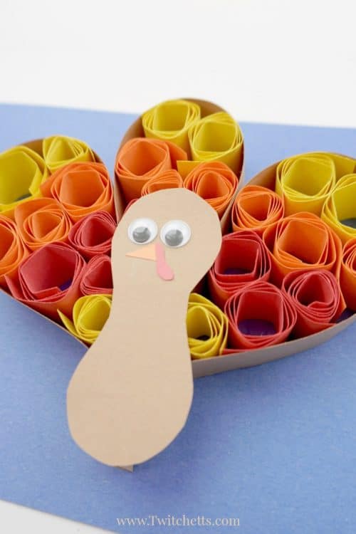 This quilled turkey paper craft is a fun and easy Thanksgiving craft that kids will enjoy creating. This kids craft combines the paper quilling process with construction paper, so it's perfect for a classroom project or for something to create while the turkey is roasting. #turkey #paperturkey #quilledturkey #thanksgiving #craftsforkids #constructionpaper #classroomcraft #twitchetts