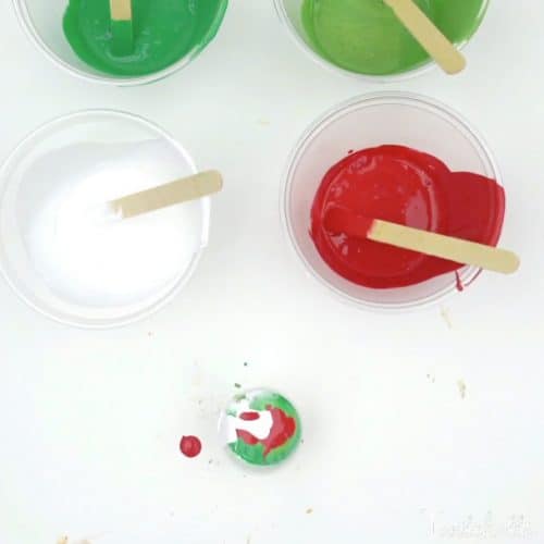 Your kids can create these amazing poured Christmas ornaments. Because pour painting is so unique, each ornament will be unique and amazing!