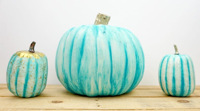 Fun teal painted plastic pumpkin to place on your porch this Halloween season. The first of this year's teal pumpkin ideas!