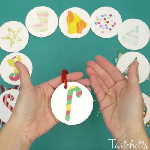 Looking for an amazing classroom Christmas craft? Grab our template and choose from the many ways to create! Parents will love getting these holiday ornaments! #paperornaments #classroomcraft #classroomornament #simpleornaments #easycraftsforkids #christmas #holidayparty #twitchetts