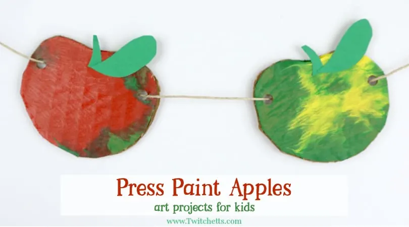 This apple themed press painted garland is so much fun to make! Apples are the perfect way to decorate a classroom for back to school or your living room for fall. Plus your kids will love that can help make them!