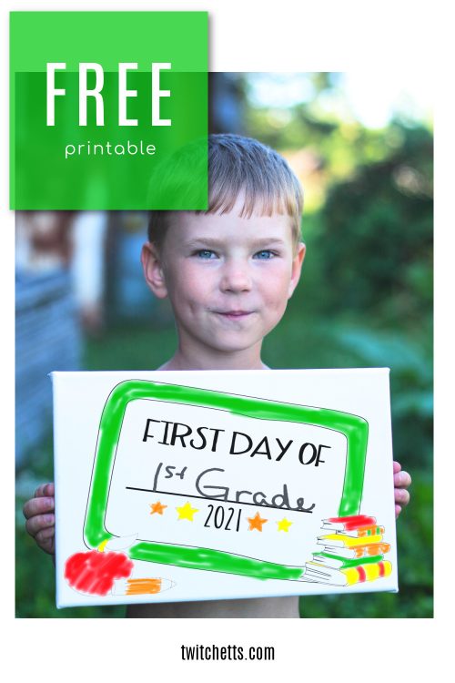 Boy holding a sign. Sign reads "first day of 1st grade 2021"