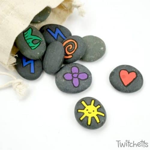 Learn how to make fun memory games out of rocks. They are a travel-ready boredom buster that's kid approved! #memorygame #rocpaintingideas #rockgame #howtomaketravelmemory #travelmemory #rockpaintingideas #giftsfrompaintedrocks #kidsactivities #twitchetts