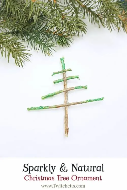 Make sparkly tree-shaped Christmas ornaments using sticks you have laying in your yard. Simple supplies and a Christmas decoration that shimmers. Your kids will be so proud to give these ornaments as gifts.  #nature #christmastree #christmasornament #sparkly #kids #twitchetts