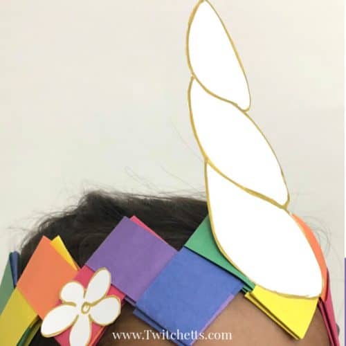 Create a fun unicorn crown using construction paper. Your child will love wearing this paper crown while pretending to be a unicorn. #unicorn #unicorncrown #unicorncraft #paperunicorn #diyunicorn #dressup #costume #makebelieve #kidscraft #constructionpaper #twitchetts