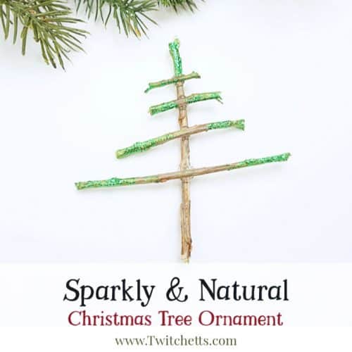 Make sparkly tree-shaped Christmas ornaments using sticks you have laying in your yard. Simple supplies and a Christmas decoration that shimmers. Your kids will be so proud to give these ornaments as gifts.  #nature #christmastree #christmasornament #sparkly #kids #twitchetts