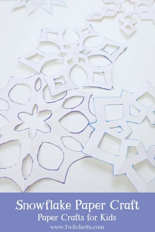 Make a six-sided snowflake paper craft with inked edges. They are perfect for winter decorating, classroom craft projects, or creating winter cards. The inked edges make the white paper pop! #snowflake #sixsided #papersnowflake #howtocutasnowflake #wintercraft #classroomcraft #classroomdecor #winterdecor #twitchetts