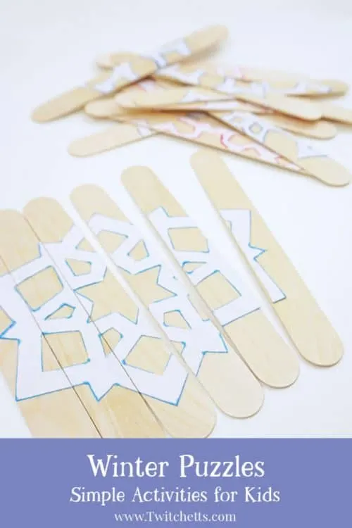 An easy winter puzzle using craft sticks and paper snowflakes. These are great for toddlers, busy bags, car rides, or to hang on your refrigerator while you are making dinner.  #winter #puzzle #snowflake #busybag #carride #roadtrip #activity #toddler #easy #craftstick #howto #twitchetts