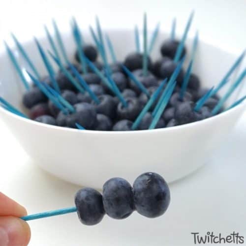 Blueberries make great blue snacks for preschool. Use skewers to keep the hands out of bowl.