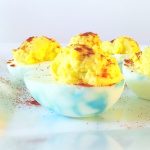 Image of red, white, and blue deviled eggs. Text Reads: "4th of July Deviled Eggs"