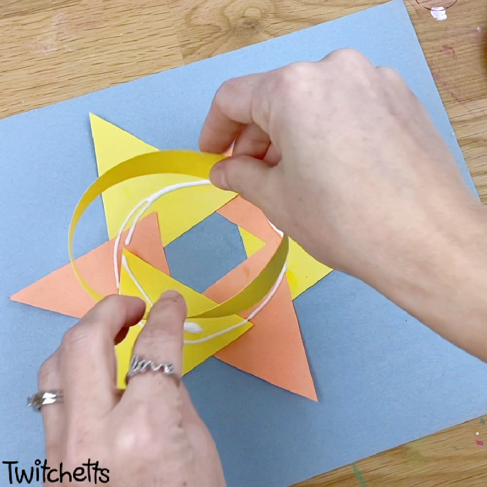 in process image of a paper quilling sun craft