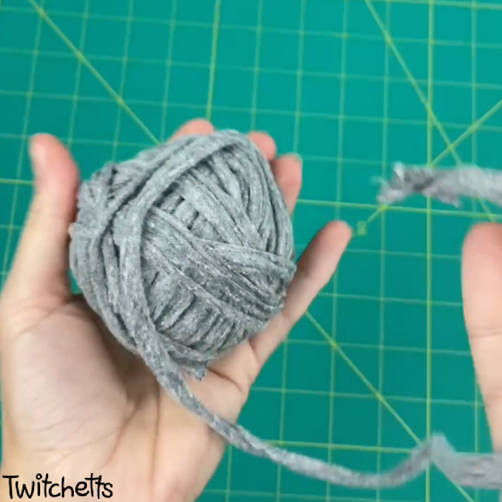 A ball of grey t-shirt yarn.