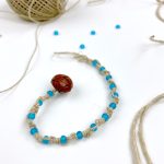 Hemp bracelet with blue beads.