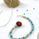 Hemp bracelet with blue beads. Text reads "Hemp - spiral bracelet"