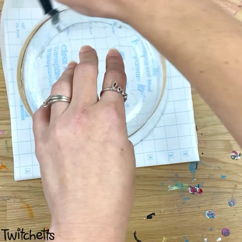 In process image of a paper snow globe craft.