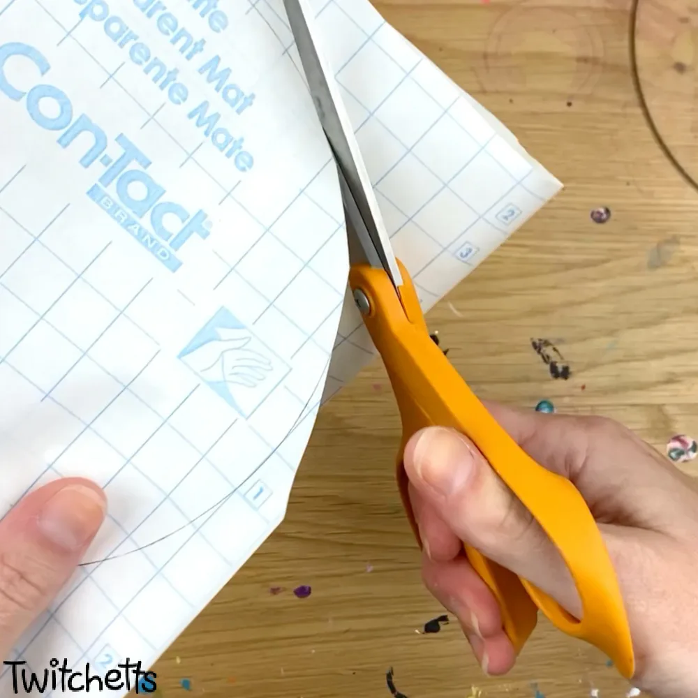 In process image of a paper snow globe craft.
