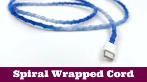 A charging cord wrapped in embroidery thread. Text reads "DIY cord wrap"