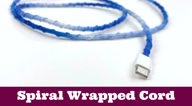 A charging cord wrapped in embroidery thread. Text reads "DIY cord wrap"